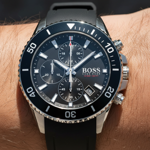 Close up shot of Hugo Boss Admiral 1513912 watch on wrist showing the black dial and luminescent hands