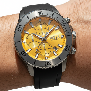 Close up shot of Hugo Boss Admiral 1513968 watch on wrist showing the yellow sunray dial and hands