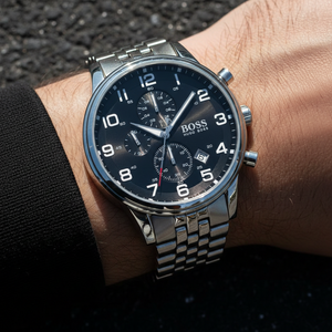 Close up shot of Hugo Boss Aeroliner 1512446 watch on wrist showing the black dial and Arabic numerals