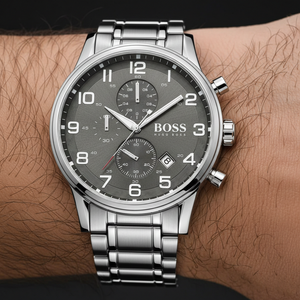 Close up shot of Hugo Boss Aeroliner 1513181 watch on wrist showing the Arabic numerals and grey dial