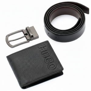 Top-down view of a Hugo Boss black genuine leather belt alongside a sleek silver-tone classic pin buckle