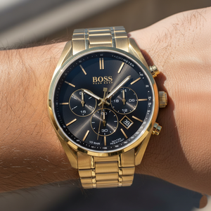 Close up shot of Hugo Boss Champion 1513848 watch on wrist showing the gold hands and date window