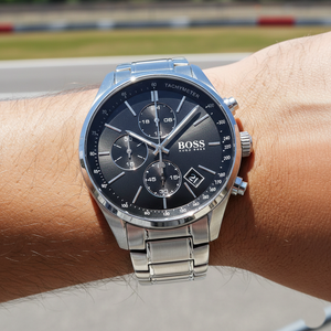 Close up shot of Hugo Boss Grand Prix 1513477 watch on wrist showing the tachymeter and racing dial