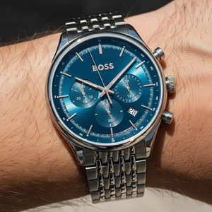 Close up shot of Hugo Boss Gregor 1514083 watch on wrist showing the blue sunray dial and grey case