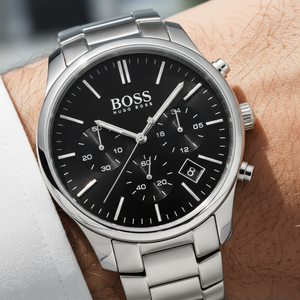 Close up shot of Hugo Boss Hero 1513433 watch on wrist showing the classic black dial and silver hands