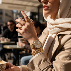 Woman wearing elegant Hugo Boss Majesty 1502552 watch with gold mesh strap