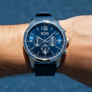 Close up shot of Hugo Boss Navigator 1513526 watch on wrist showing the blue dial and tachymeter details