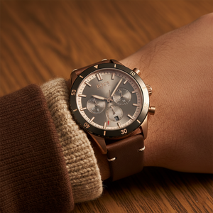 Close up shot of Hugo Boss Santiago 1513861 watch on wrist showing the grey sunray dial and rose gold details