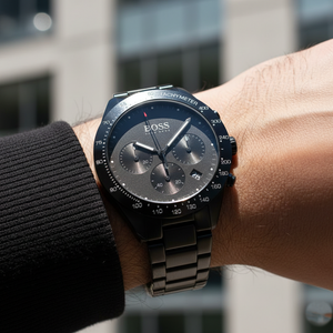 Close up shot of Hugo Boss Talent 1513581 watch on wrist showing the ceramic links and black dial