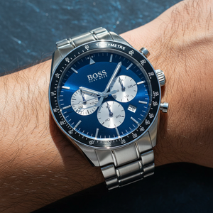 Close up shot of Hugo Boss Trophy 1513630 watch on wrist showing the blue sunray dial and tachymeter bezel