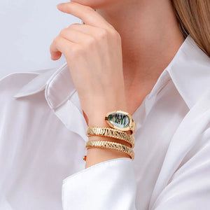 Close up shot of Just Cavalli JC1L226M0035 on wrist showing the elegant gold snake design coiled three times and green silver dial from Luxury Hub Store