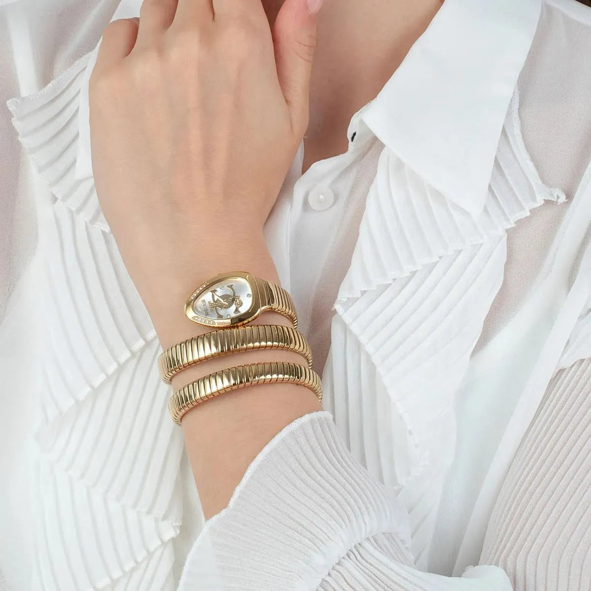 Gold bracelets on a wrist with a white background