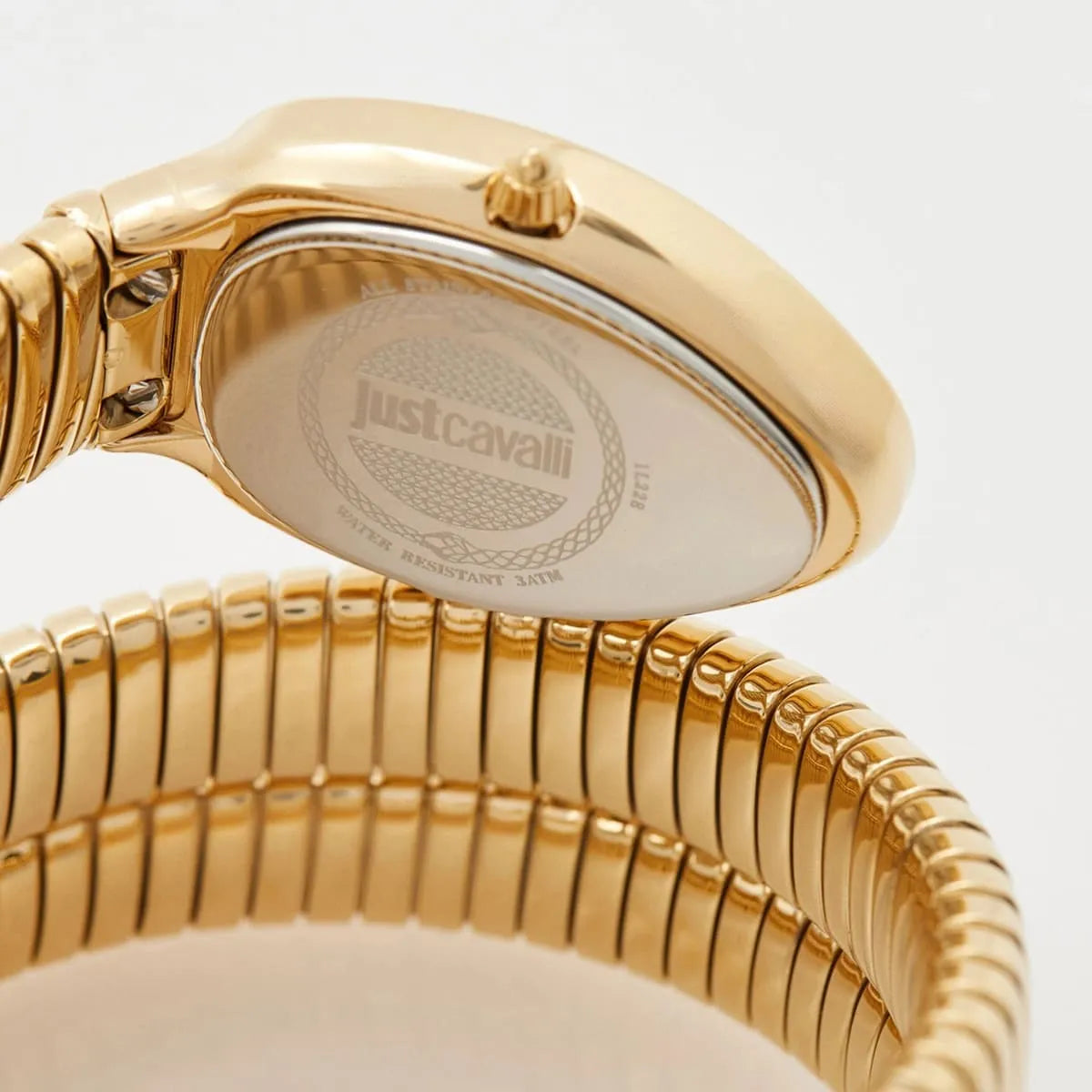 Gold watch with 'Just Cavalli' branding on a light gray background