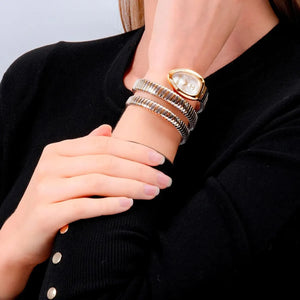Close up shot of Just Cavalli JC1L230M0065 on wrist showing the elegant two-tone snake design and white dial from Luxury Hub Store