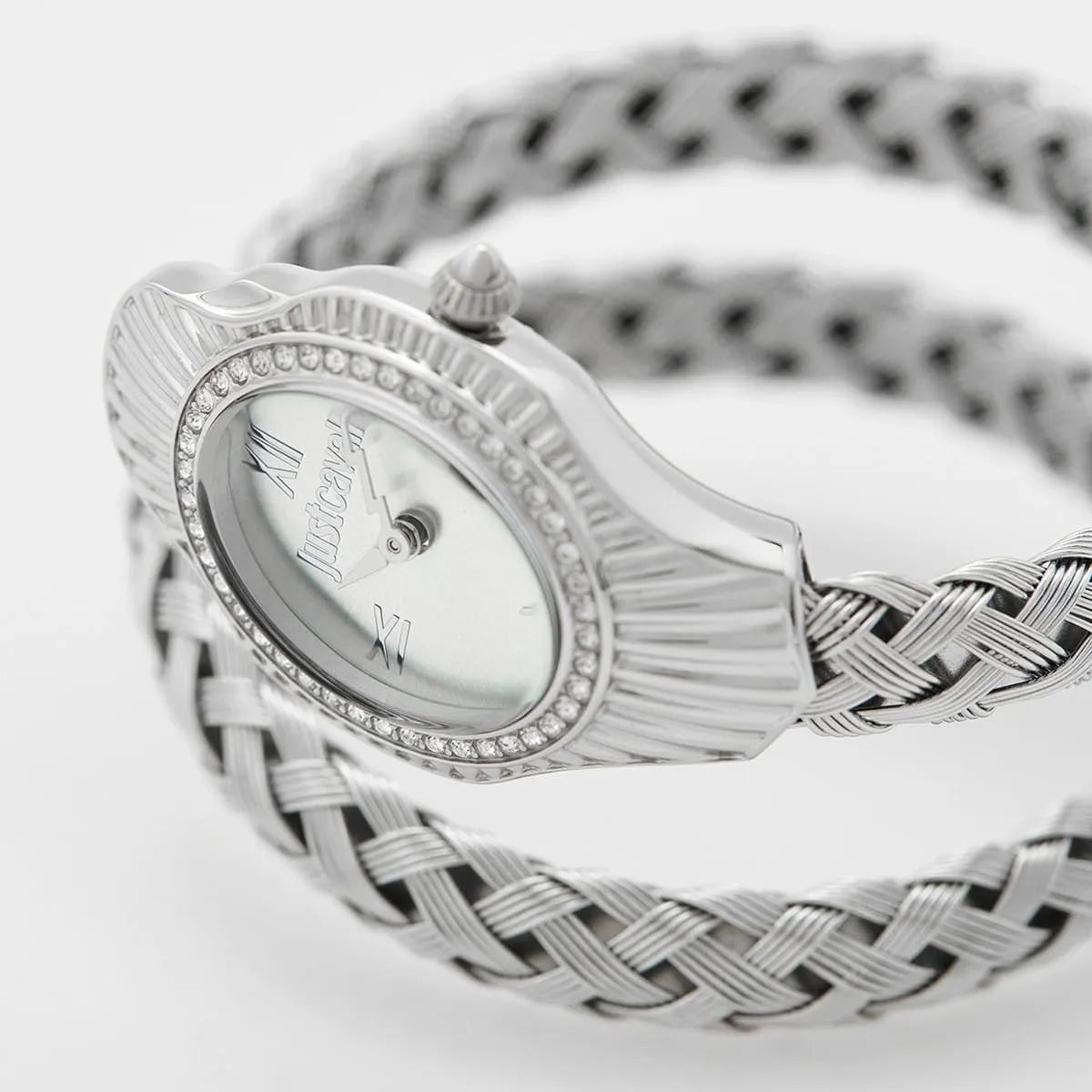 Angled real-life photo of Just Cavalli JC1L305M0015 showing the silver-tone snake head case design and crystal accents from Luxury Hub Store