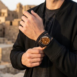 Lifestyle photo of Fossil JR1356 showing the watch on a man's wrist with solid black steel bracelet