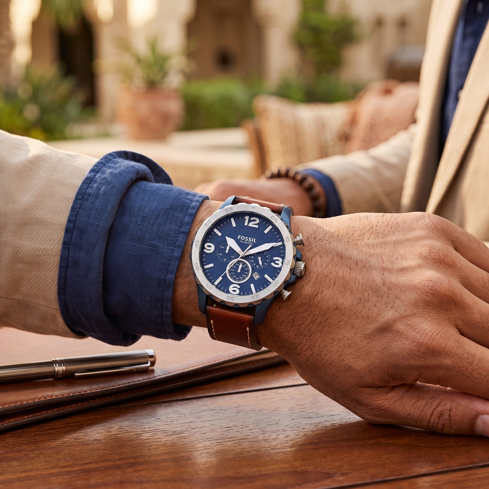 Fossil Nate JR1504 men's navy blue dial chronograph watch worn on wrist