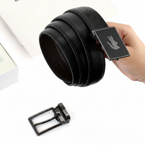 Handheld perspective of a rolled Lacoste black leather belt featuring a sleek modern plaque buckle with the signature silver crocodile logo