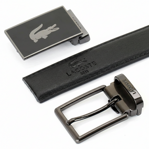 Top-down view of the Lacoste reversible belt showcasing the black leather side and its two interchangeable designer metal buckles