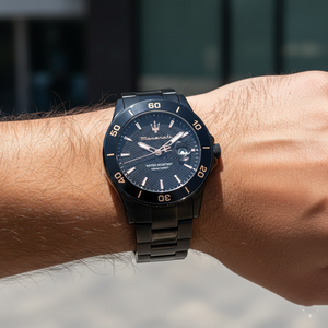 Close up shot of Maserati Competizione R8853100035 on wrist showing the black textured dial and gold hands