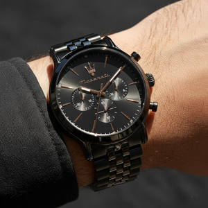 Close up shot of Maserati Epoca R8873618019 on wrist showing the black dial and rose gold trident logo