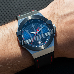 Close up shot of Maserati Potenza R8851108001 watch on wrist showing the black dial and red hands