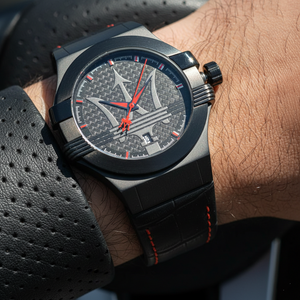 Close up shot of Maserati Potenza R8851108010 watch on wrist showing the black dial and red hands