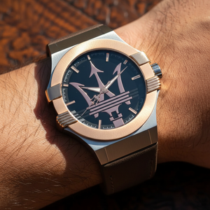 Close up shot of Maserati Potenza R8851108014 watch on wrist showing the black dial and rose gold Trident logo