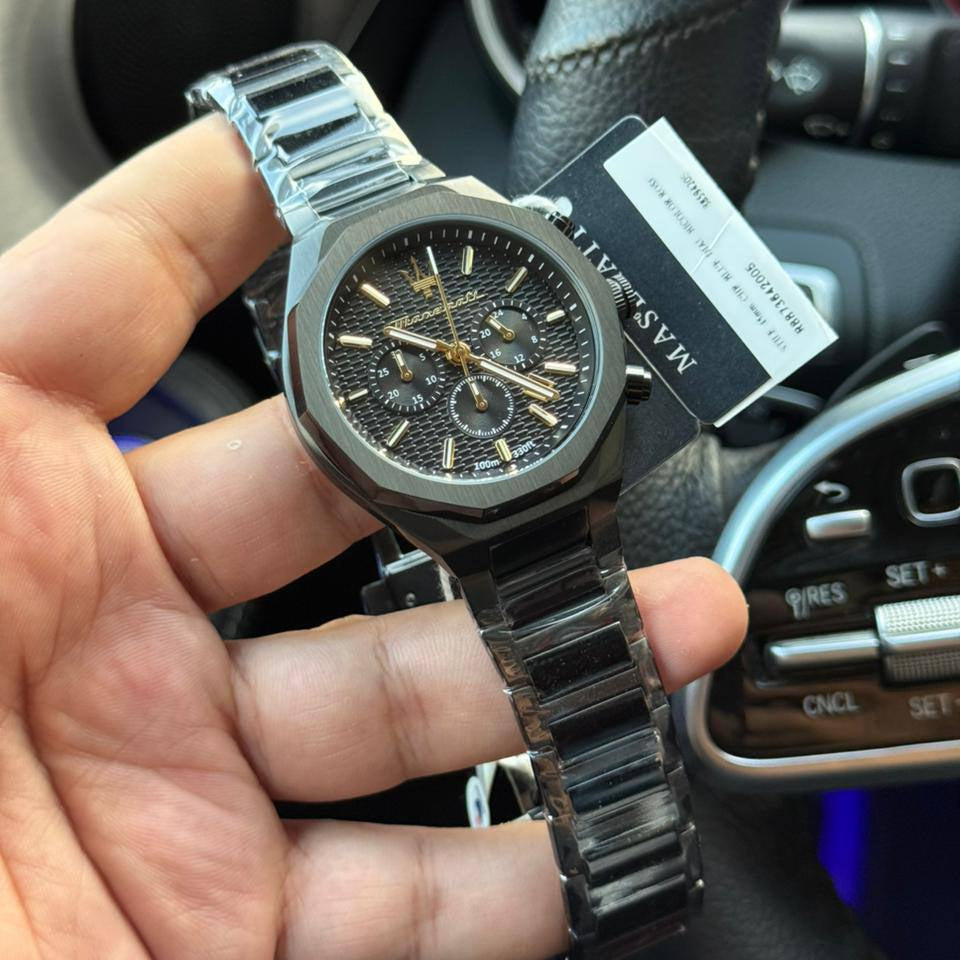 Authentic real-life photo of Maserati Stile R8873642005 showing actual black and gold finish