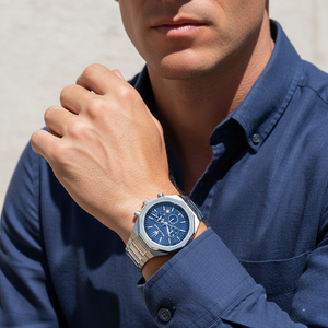 Man wearing Maserati Stile silver watch with a formal business shirt for a luxury executive look