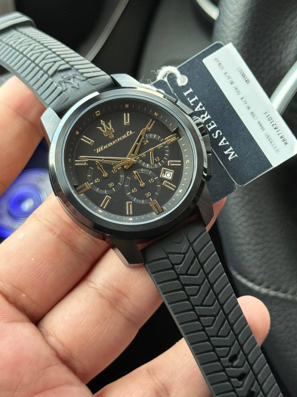Authentic real-life photo of the Maserati Successo R8871621011 watch showing actual black finish and gold accents