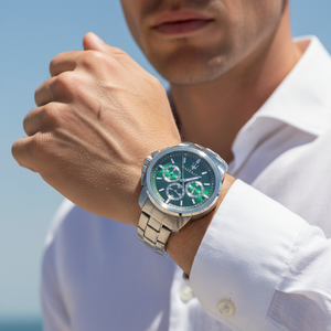 Close up shot of Maserati Successo R8873621017 on wrist showing the green sunray dial and silver trident logo
