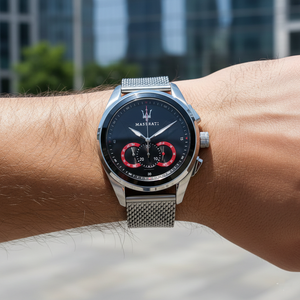 Close up shot of Maserati Traguardo R8873612005 on wrist showing the black dial and silver mesh strap shimmer