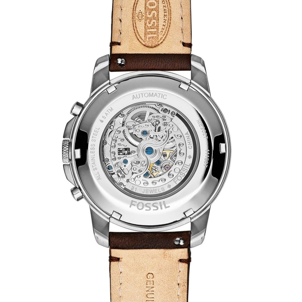 Fossil watch with brown leather strap on a white background