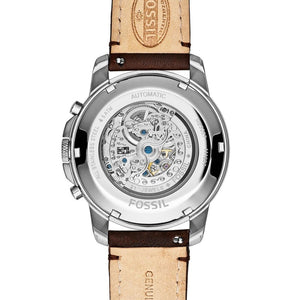 Fossil watch with brown leather strap on a white background
