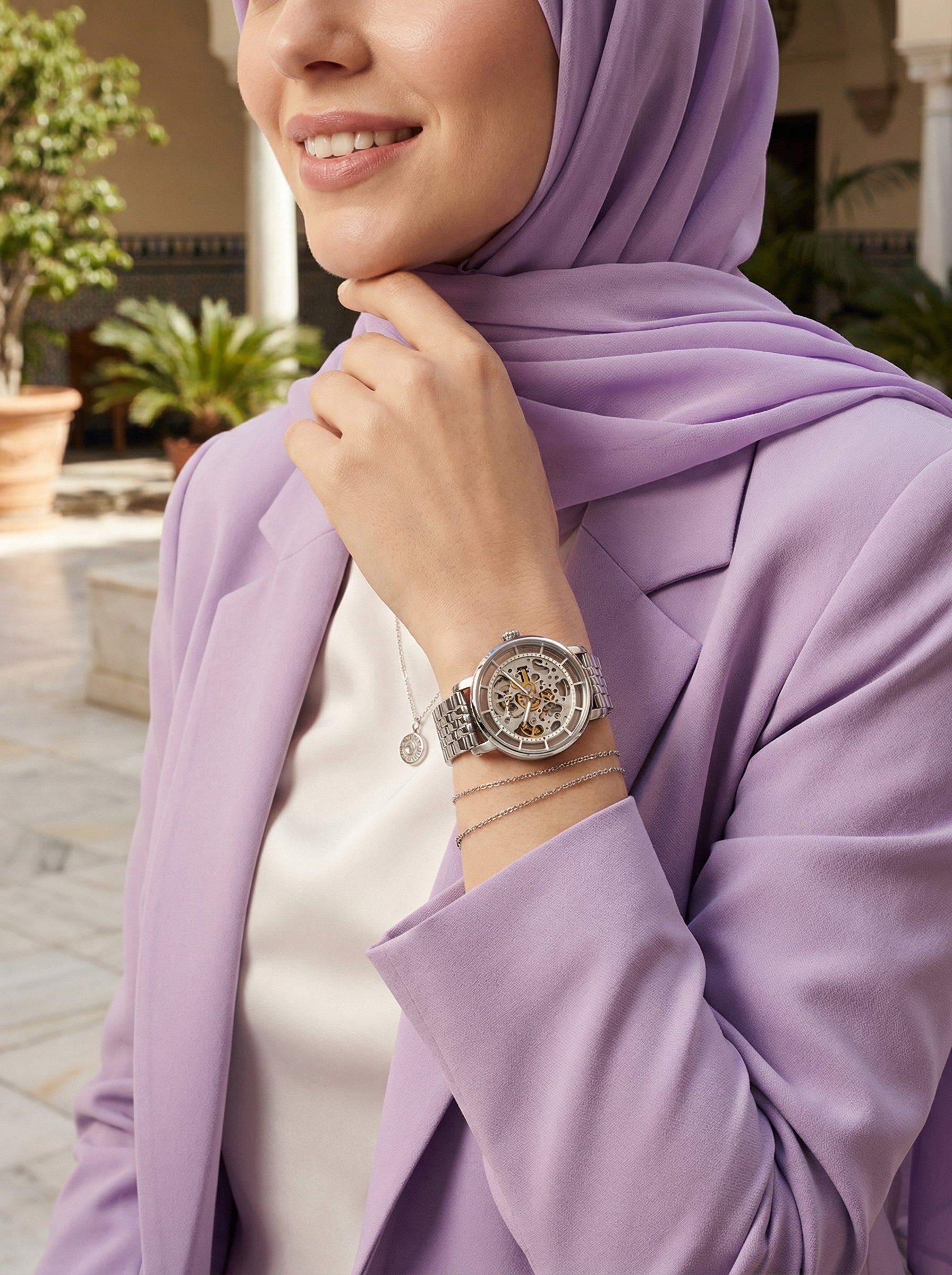 Lifestyle photo of Fossil ME3067 showing the bold silver automatic watch on a woman's wrist