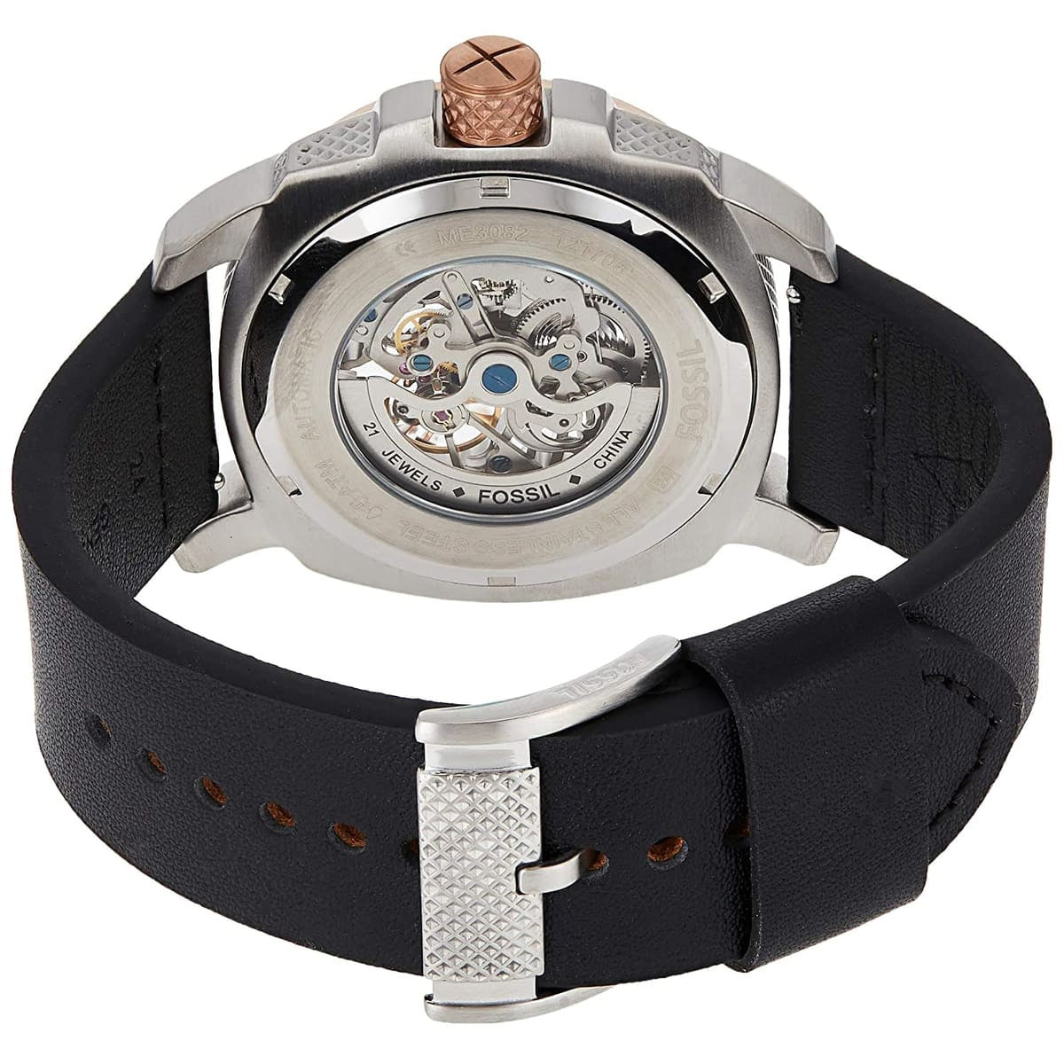 Back view of a Fossil watch with black strap and silver case on a white background