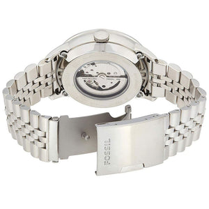 Silver Fossil watch with open face on a white background