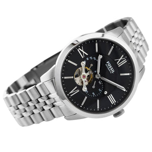 Silver wristwatch with black dial and visible brand name on a white background