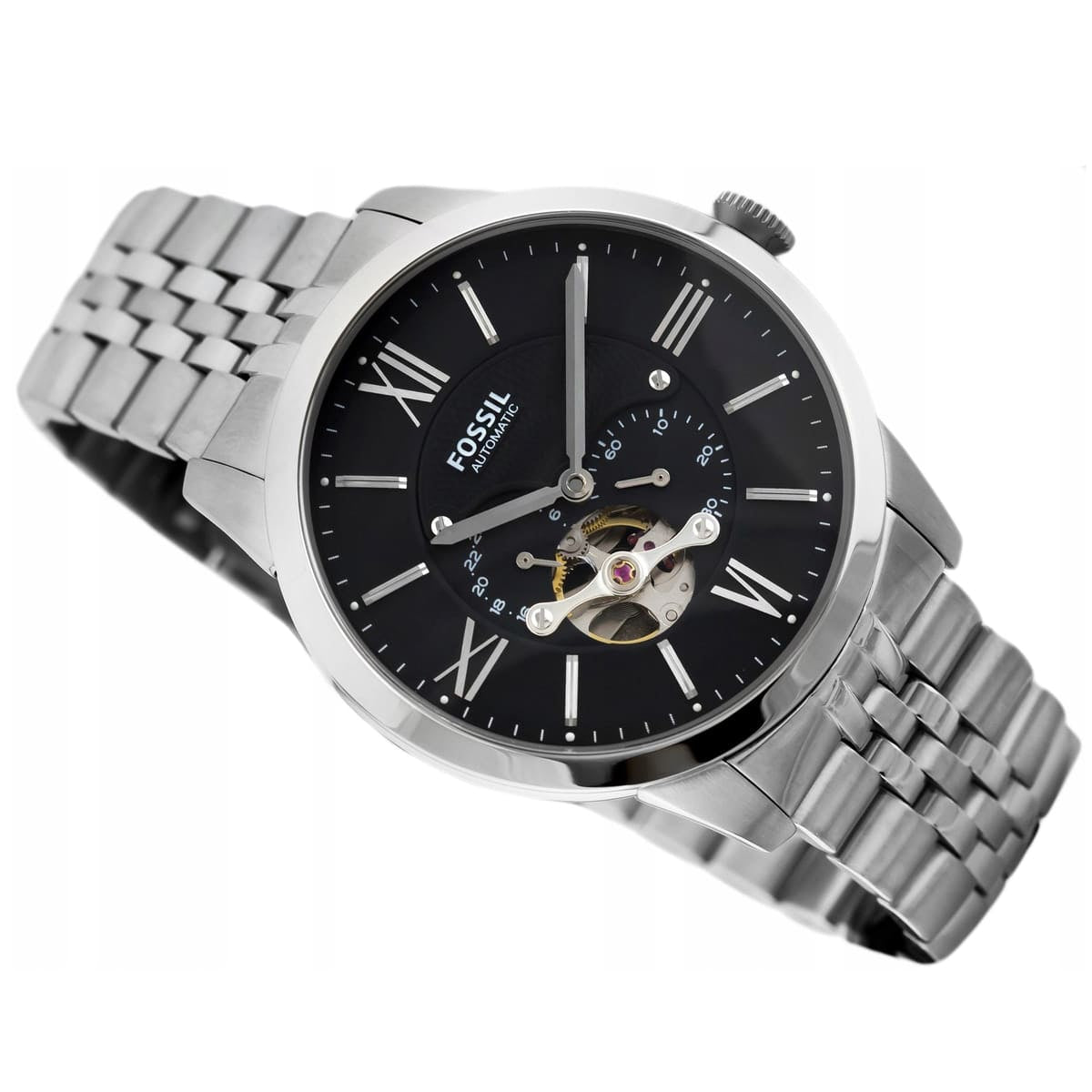 Fossil watch with black dial and silver metal band on a white background
