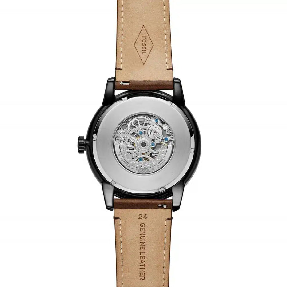 Watch with a brown leather strap and visible brand logo on a white background
