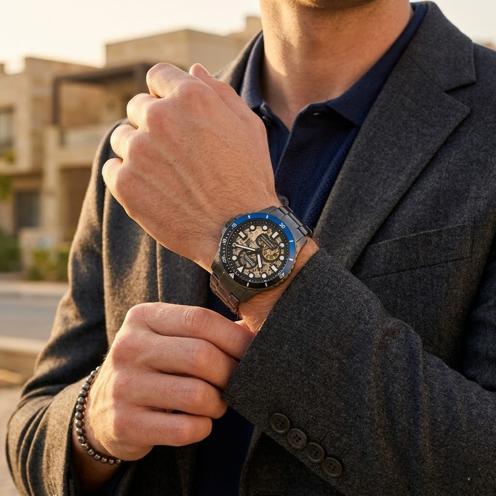 Lifestyle photo of Fossil ME3201 showing the bold gunmetal automatic watch on a man's wrist
