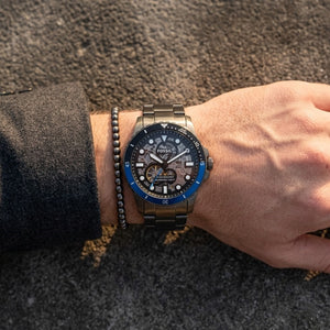 Close up shot of Fossil ME3201 on wrist showing the transparent mechanical gunmetal movement