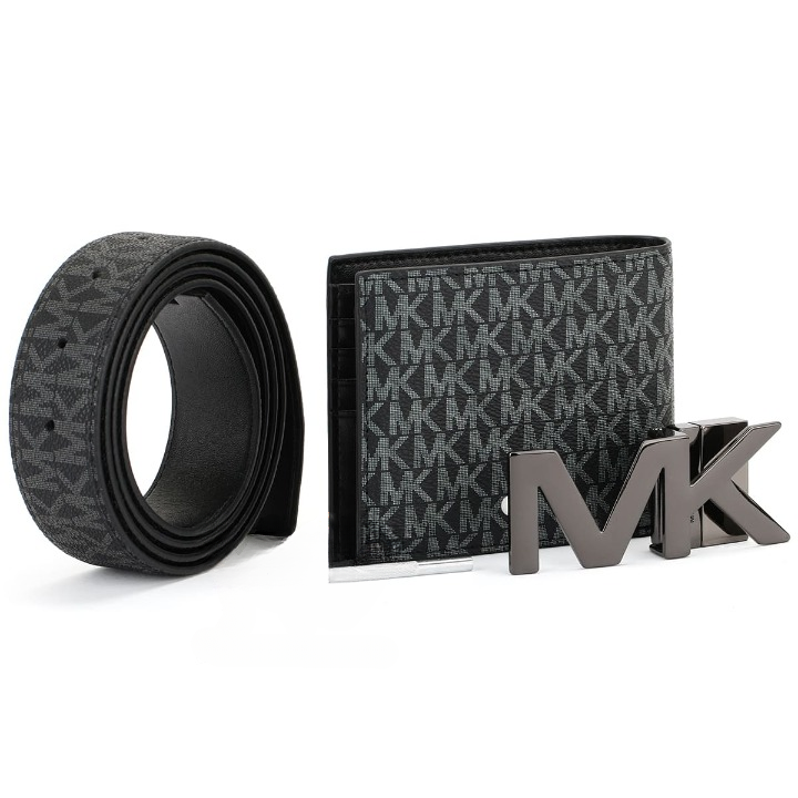 Display of a Michael Kors men's black gift set showcasing the wallet's interior slots, rolled reversible belt, and rotating metal MK buckle