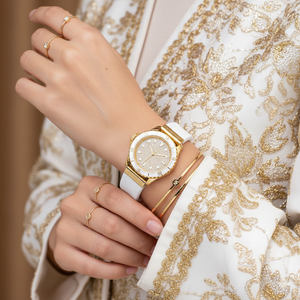 Detailed view of the white sporty bezel with gold-tone numerical markers on the Michael Kors MK7357