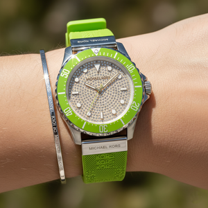 Close up of the MK7360 silver dial showing the full pavé crystal encrusting and luminous geometric markers