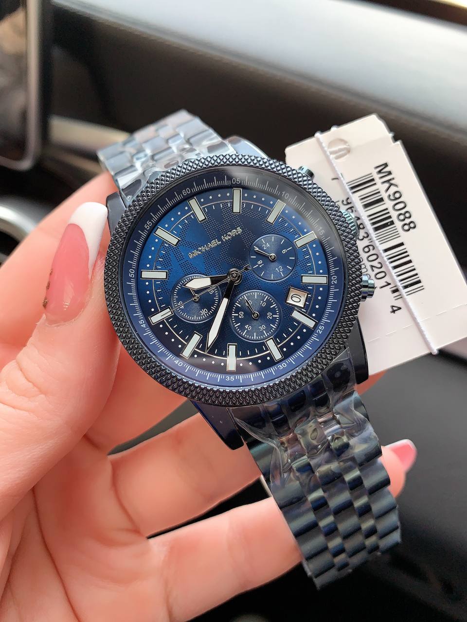 Extreme close-up of the premium matte navy blue ion-plating on the Michael Kors MK9088 case