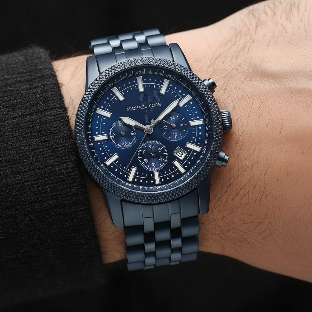 Close up of the MK9088 navy blue dial showing the embossed MK logo pattern and chronograph sub-dials