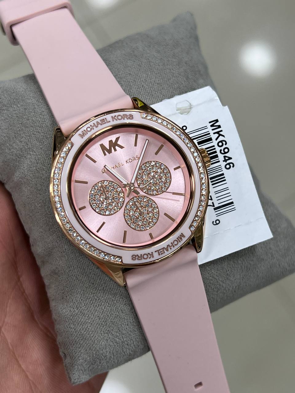 Close up of the MK6946 pink dial showing rose gold-tone indices and multifunction sub-dials