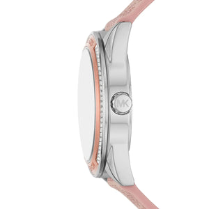 Side-on shot of the MK7206 two-tone case emphasizing the rose gold-tone textured crown and sleek architectural lugs